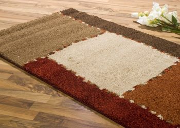 a rug on wood flooring