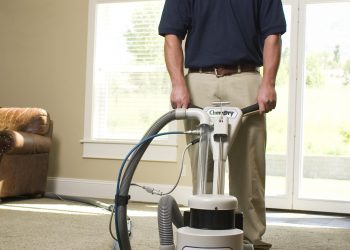 Man cleaning a carpet